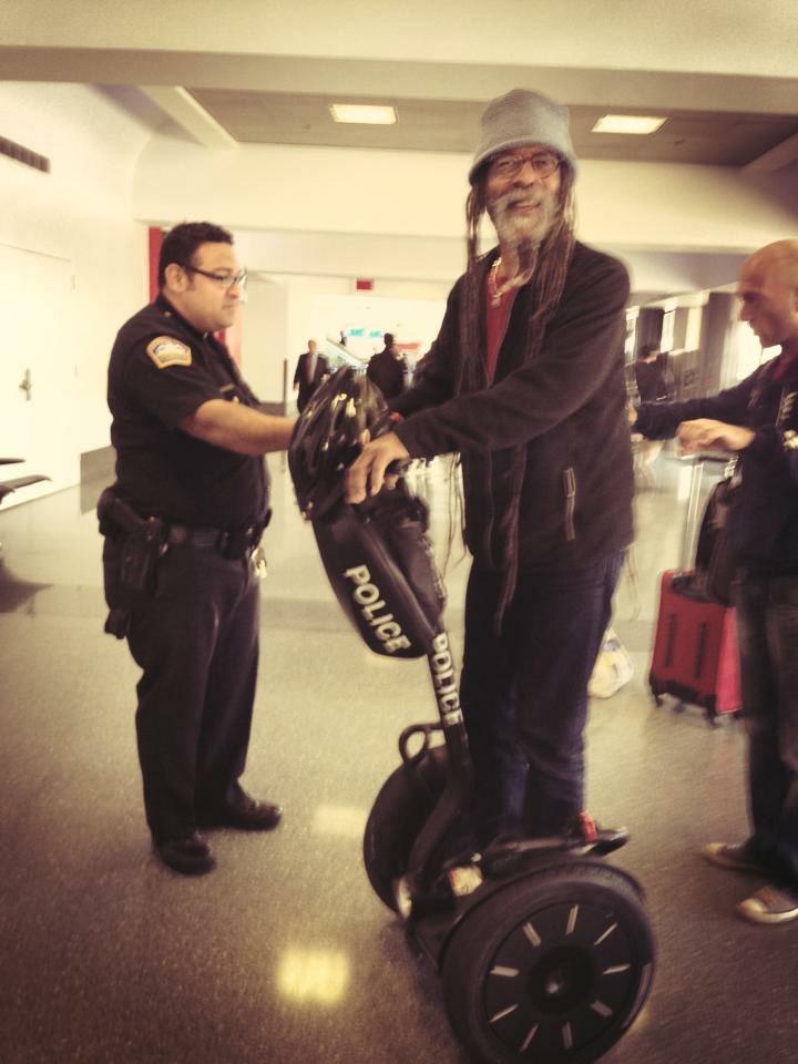 Larry McDonald riding a cop's Segway